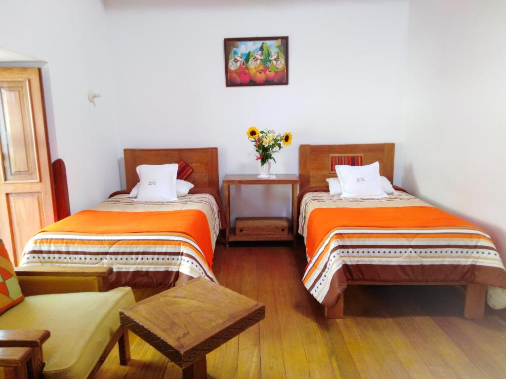 Postel nebo postele na pokoji v ubytování Casa San Pedro Cusco
