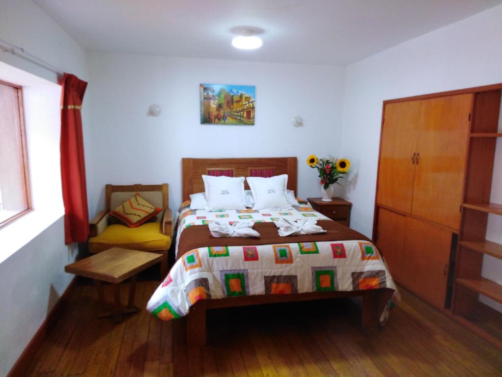 Postel nebo postele na pokoji v ubytování Casa San Pedro Cusco