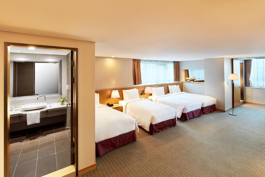 Cama ou camas em um quarto em Hotel PJ Myeongdong