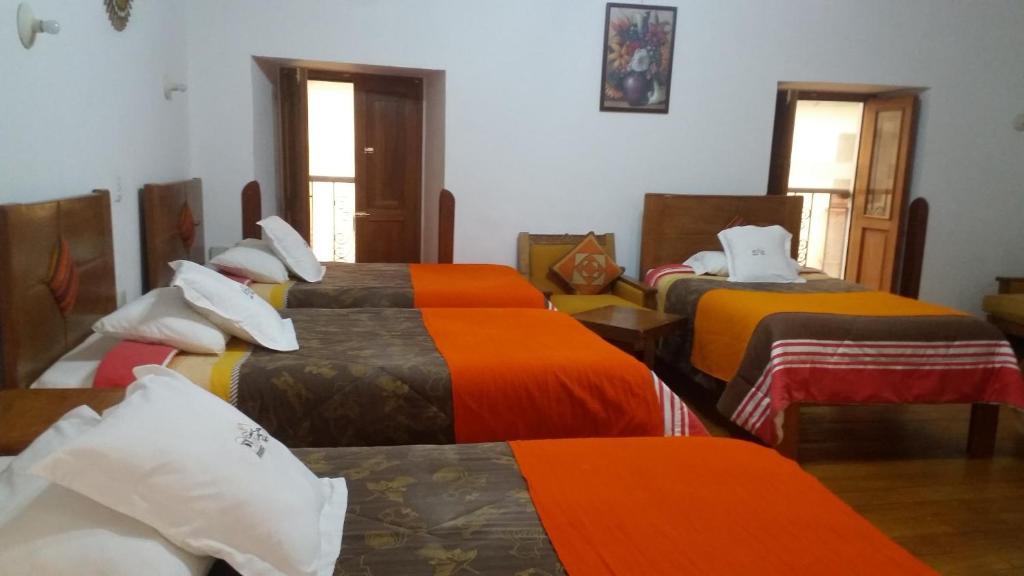 Postel nebo postele na pokoji v ubytování Casa San Pedro Cusco
