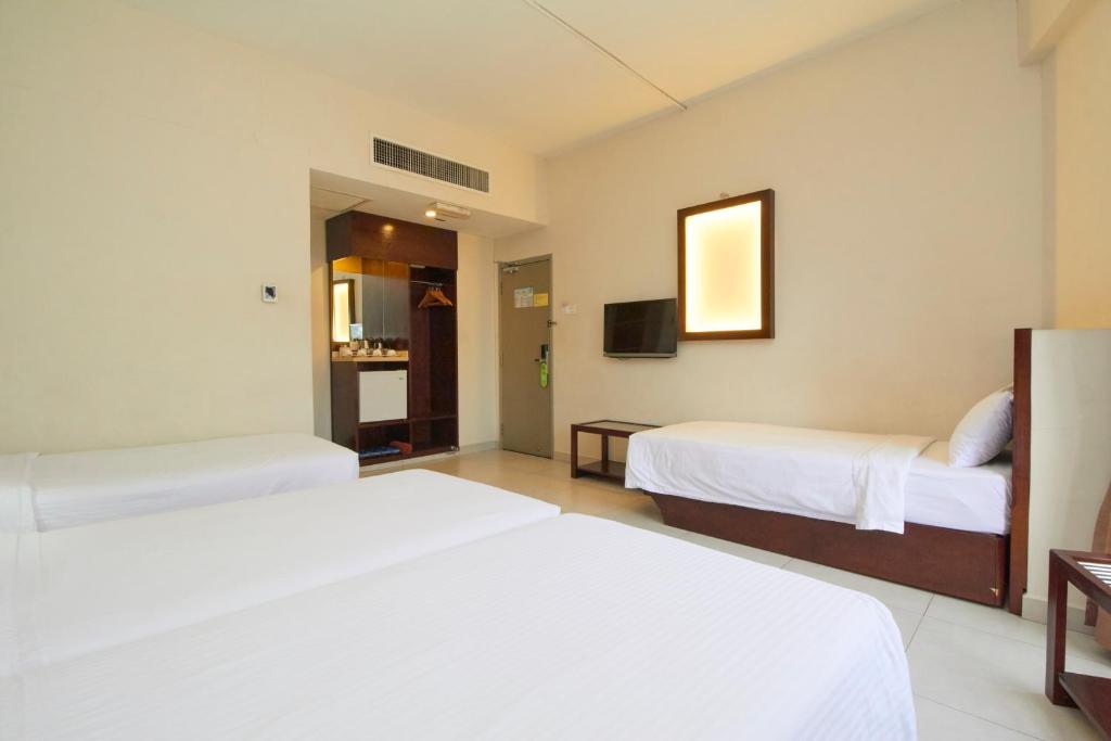 Postel nebo postele na pokoji v ubytování Kepong Hotel