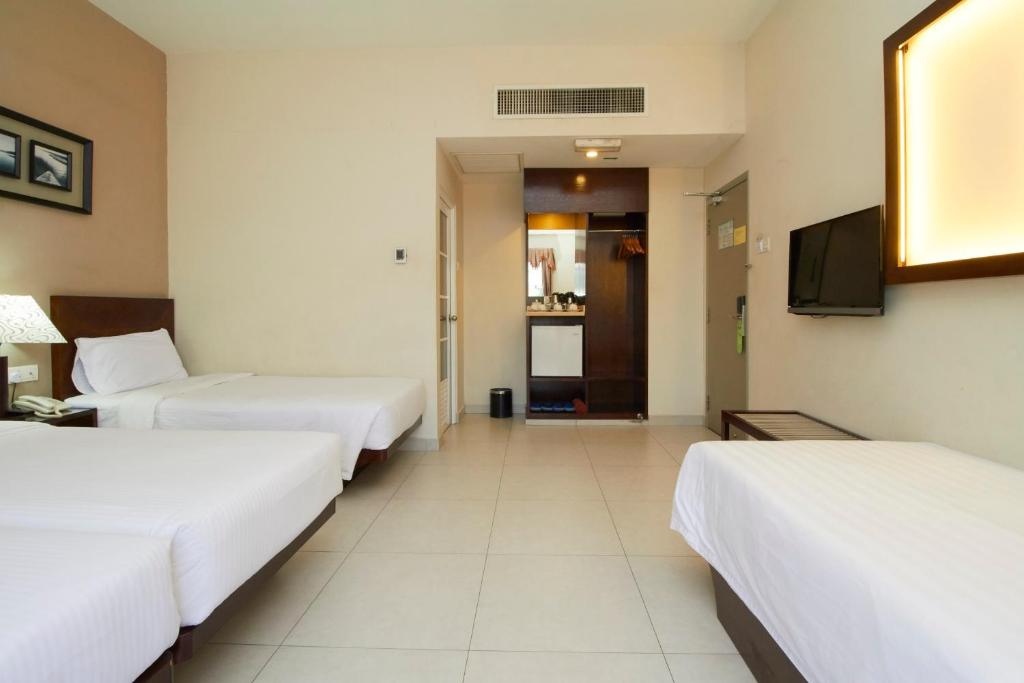 Postel nebo postele na pokoji v ubytování Kepong Hotel