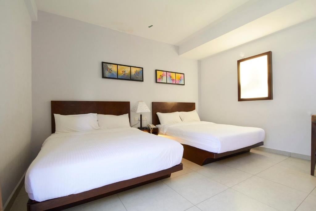 Postel nebo postele na pokoji v ubytování Kepong Hotel