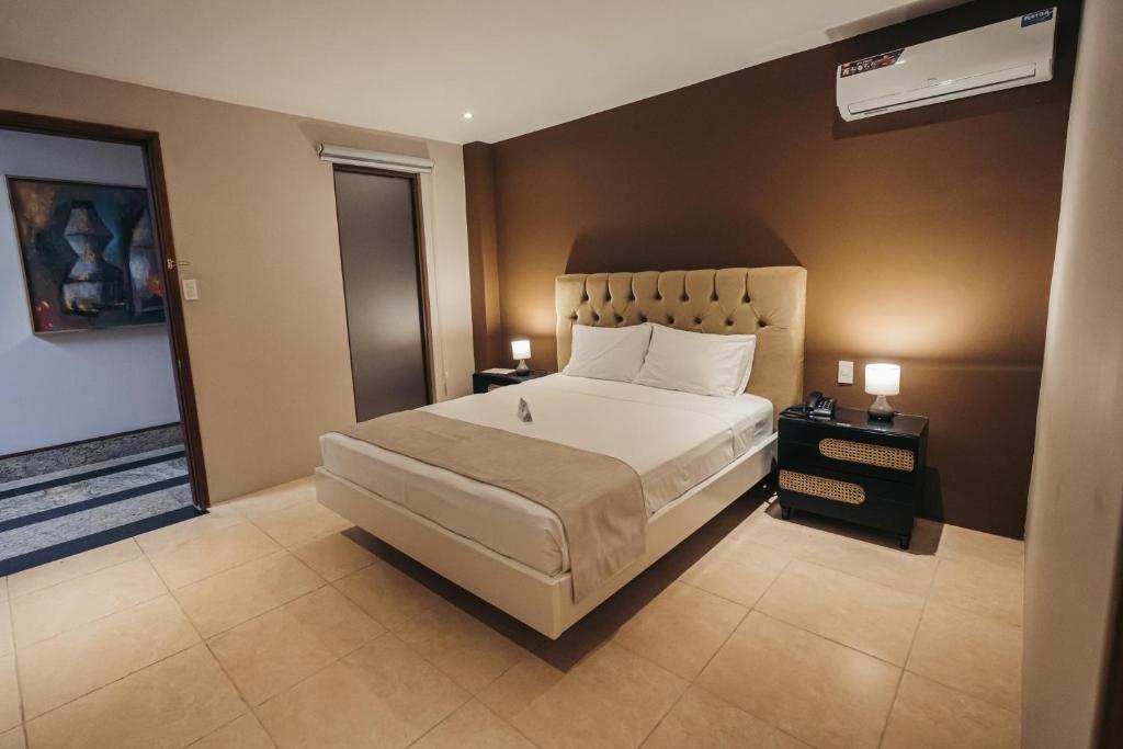 Postel nebo postele na pokoji v ubytování Luxva Hotel Boutique