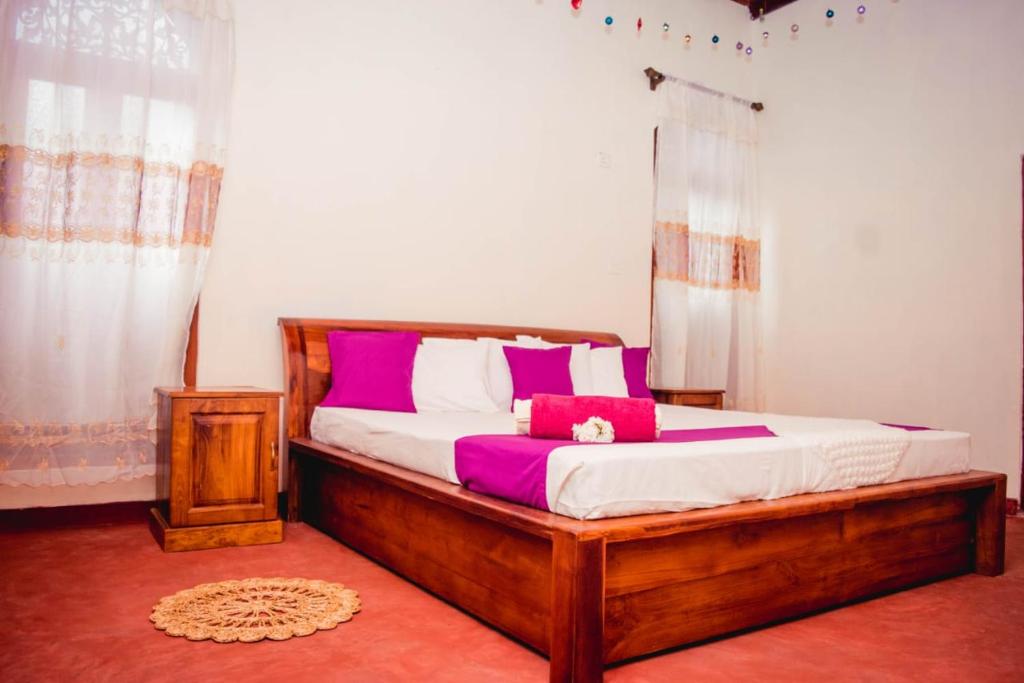 Postel nebo postele na pokoji v ubytování 4ty two Homestay Galle