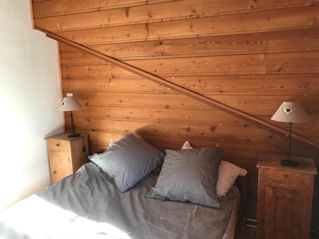 Voodi või voodid majutusasutuse Chalet Beauroc toas