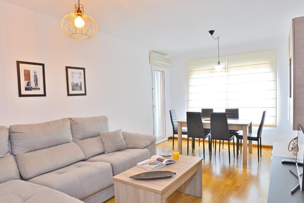 a living room with a couch and a table at MyFlats Bulevar in Alicante