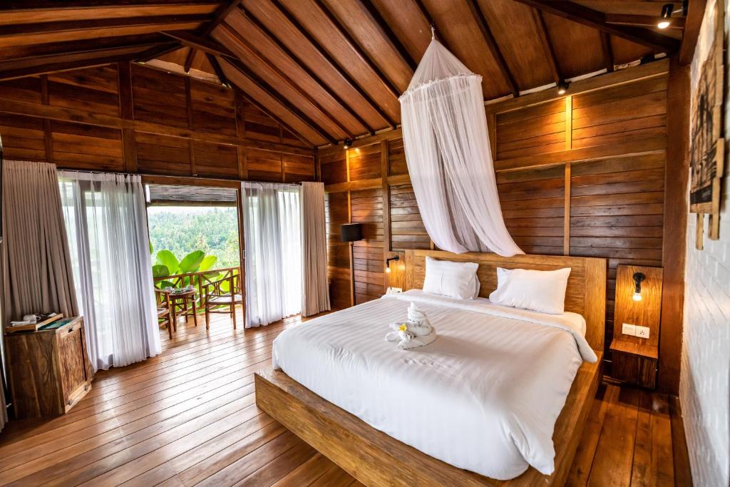 Postel nebo postele na pokoji v ubytování Bali De Pardis Cottage