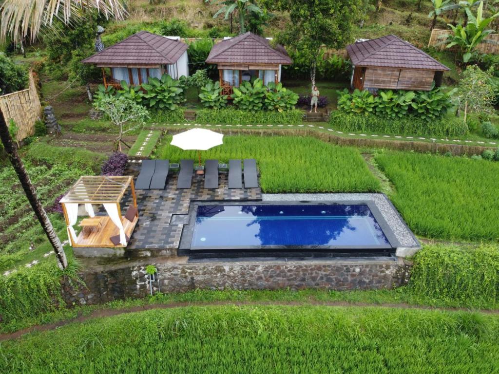 Bazén v ubytování Bali De Pardis Cottage nebo v jeho okolí