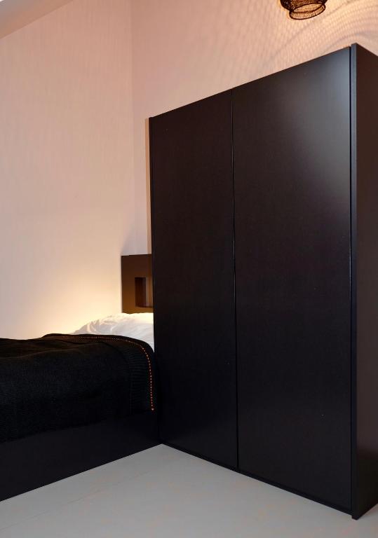 Postel nebo postele na pokoji v ubytování Le Presbytère