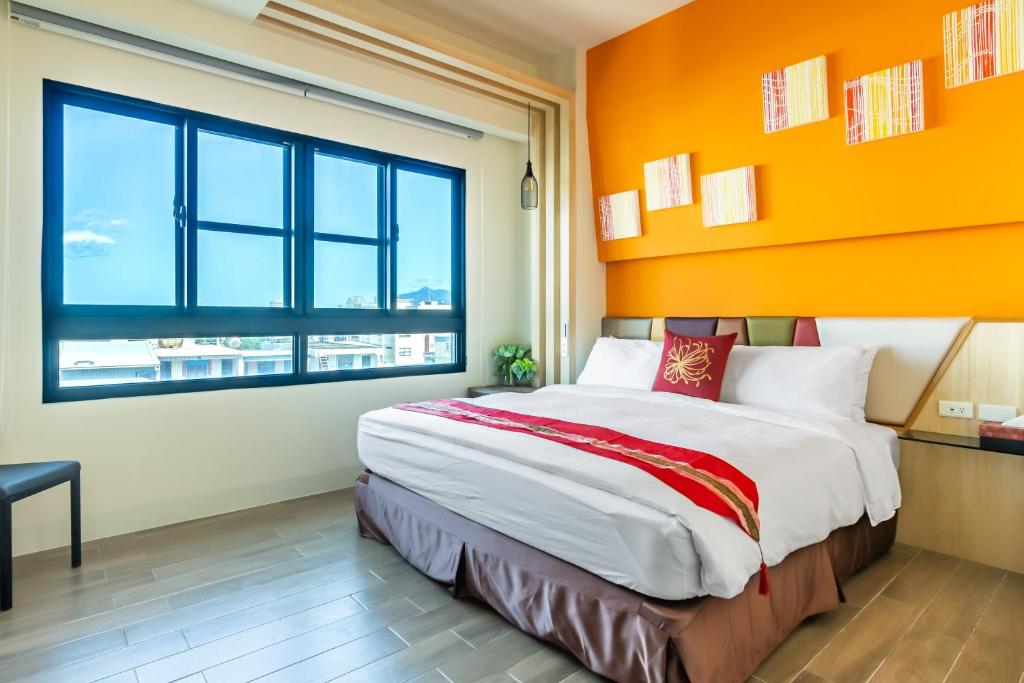 Postel nebo postele na pokoji v ubytování Mambo Boutique Hotel