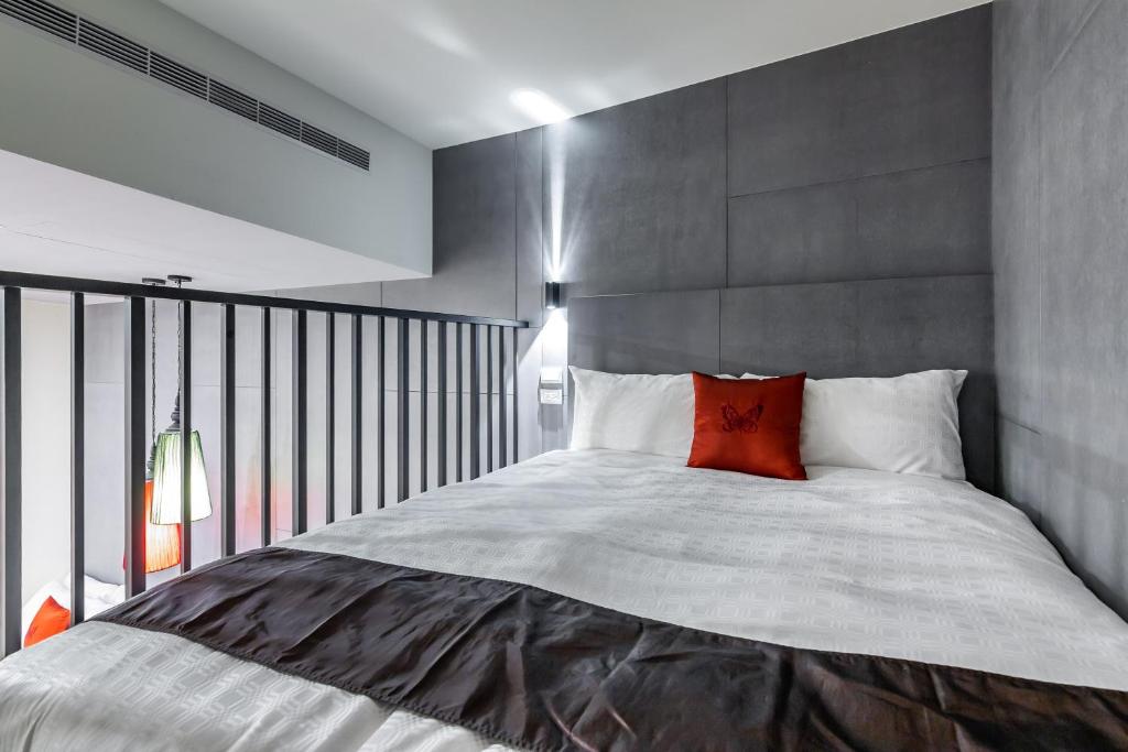 Postel nebo postele na pokoji v ubytování Mambo Boutique Hotel