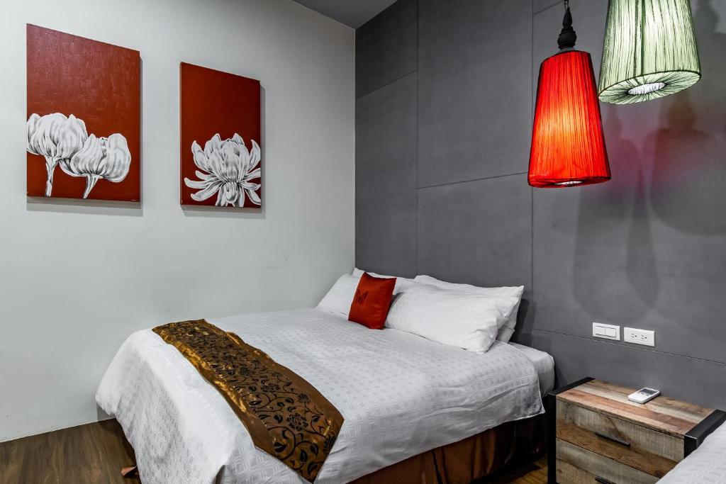 Postel nebo postele na pokoji v ubytování Mambo Boutique Hotel