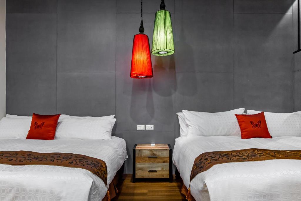 Postel nebo postele na pokoji v ubytování Mambo Boutique Hotel