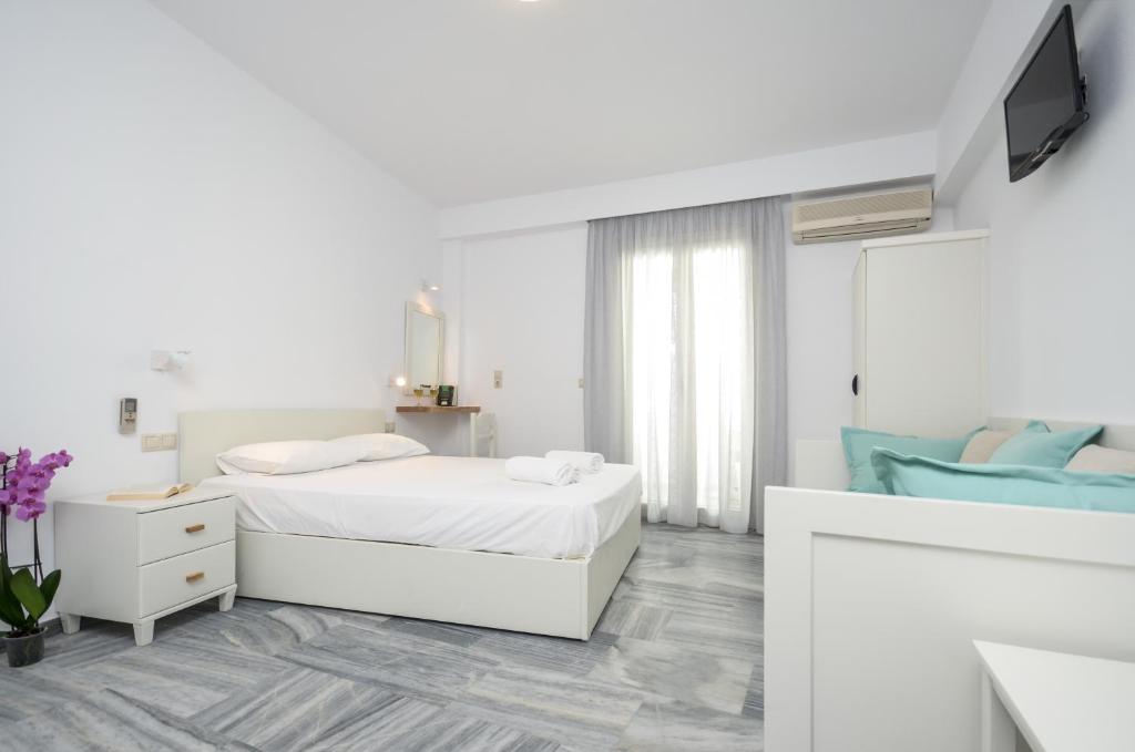 A bed or beds in a room at Soula Naxos