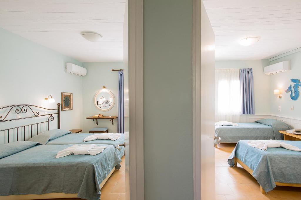 Postel nebo postele na pokoji v ubytování Spiti Prifti Apartments