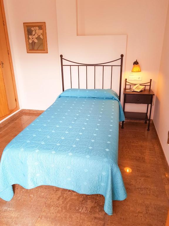 Postel nebo postele na pokoji v ubytování Hotel Plaza Escribano