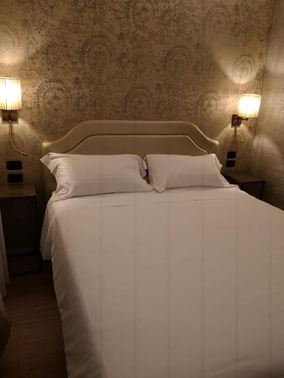 Postel nebo postele na pokoji v ubytování Locanda Cavanella