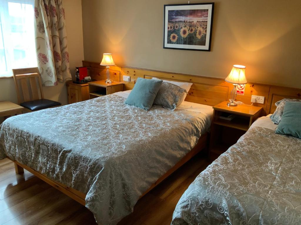 Postel nebo postele na pokoji v ubytování Algret House B&B