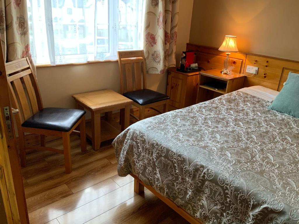 Postel nebo postele na pokoji v ubytování Algret House B&B