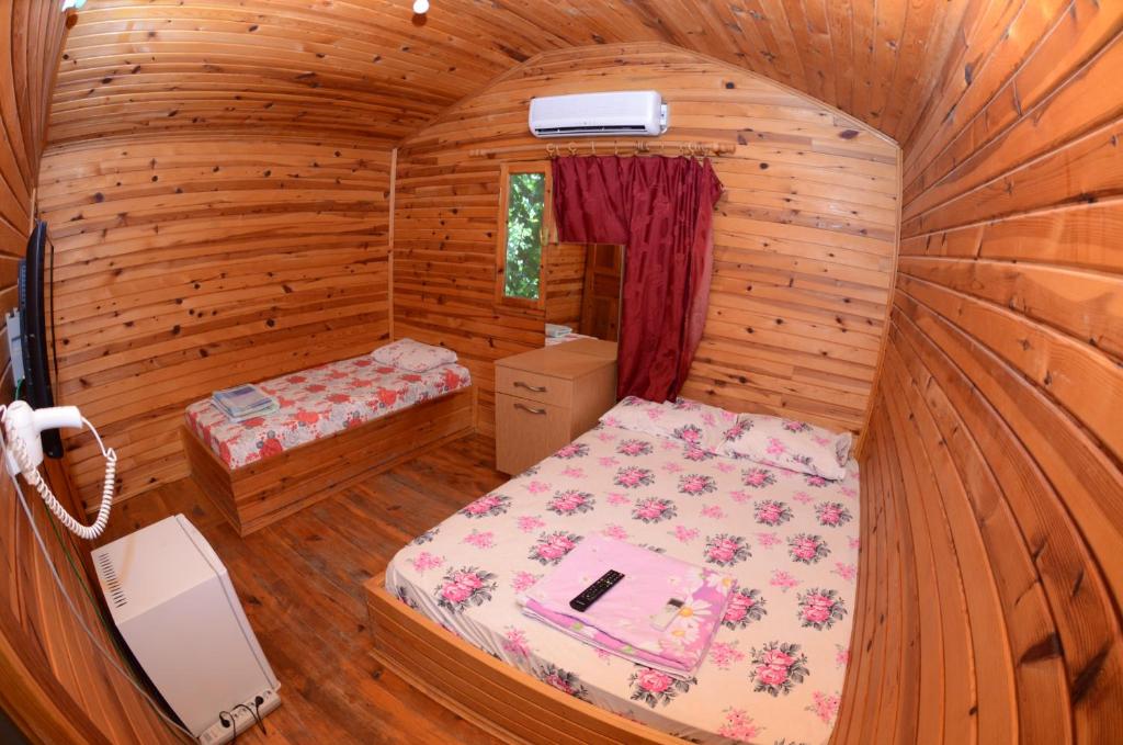 Postel nebo postele na pokoji v ubytování Olympos Camlık Pension