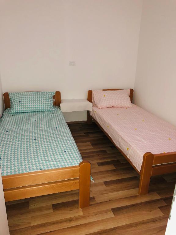 Postel nebo postele na pokoji v ubytování Apartman Lina