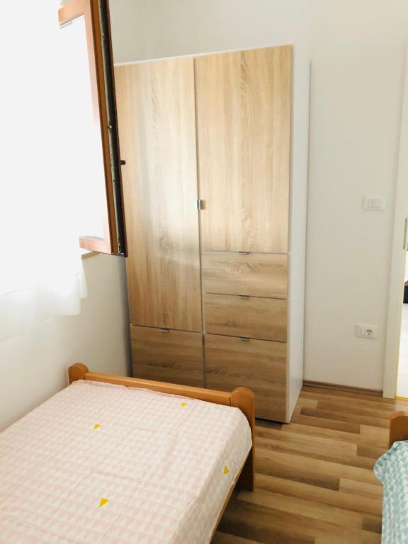 Postel nebo postele na pokoji v ubytování Apartman Lina