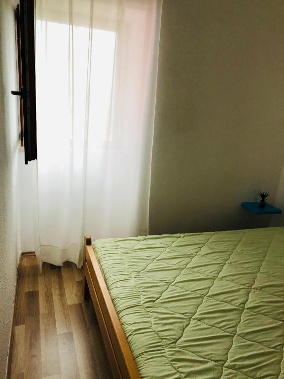 Postel nebo postele na pokoji v ubytování Apartman Lina