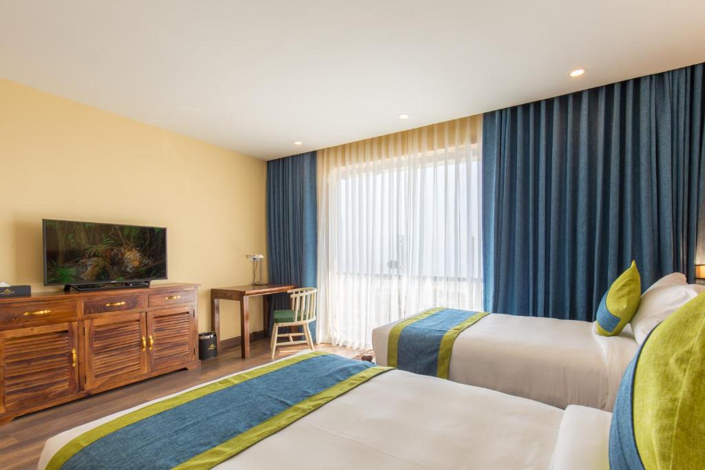 Postel nebo postele na pokoji v ubytování Aagantuk Resort