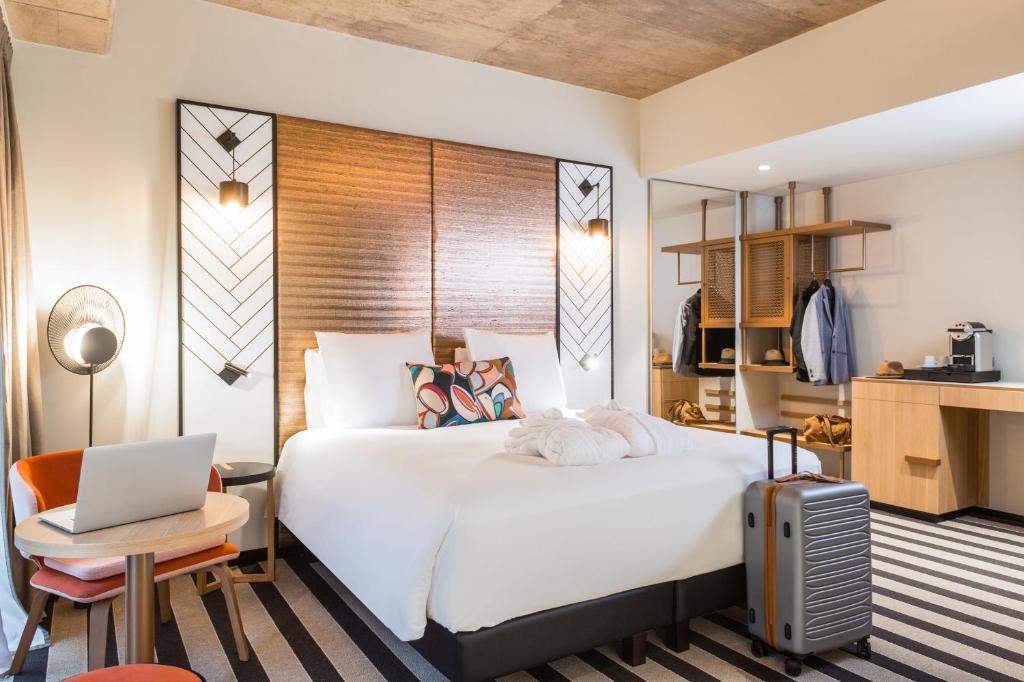 Cama ou camas em um quarto em Mercure Luxembourg Off Kirchberg