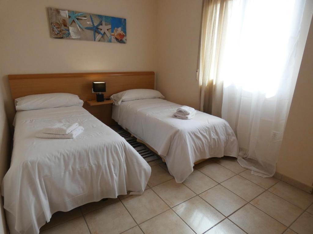 Posteľ alebo postele v izbe v ubytovaní Anacasa Vora Golf II Playa Rabdells AP437