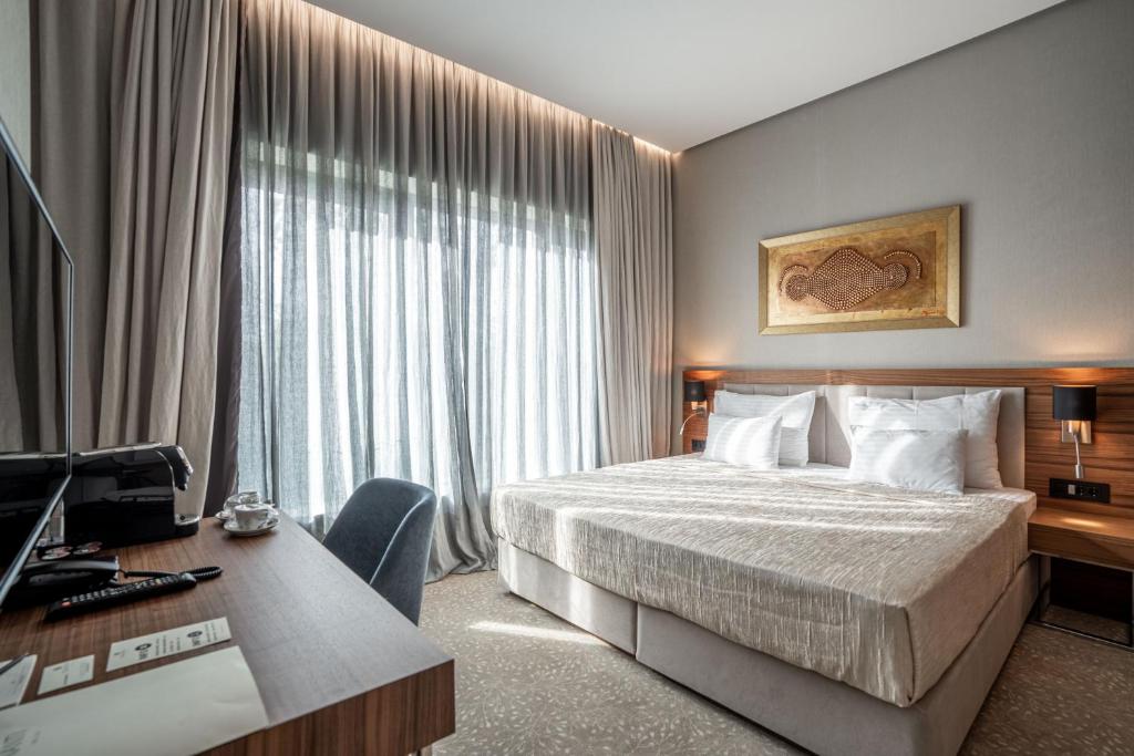 Postel nebo postele na pokoji v ubytování Hotel Tonanti