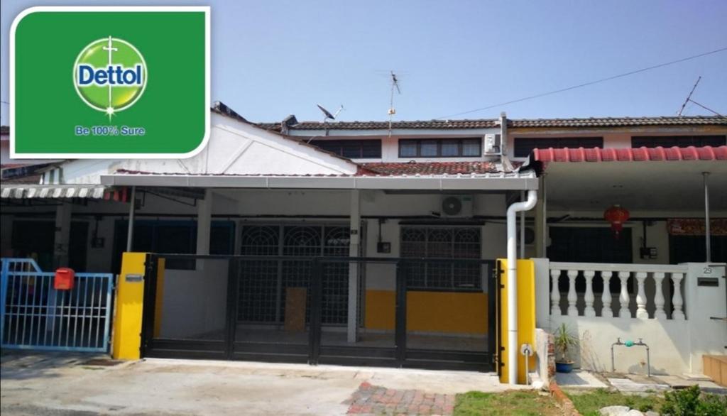 a building with a green sign in front of it at Josh's garage 2.0 Lost World Tambun for 8-10pax in Ipoh