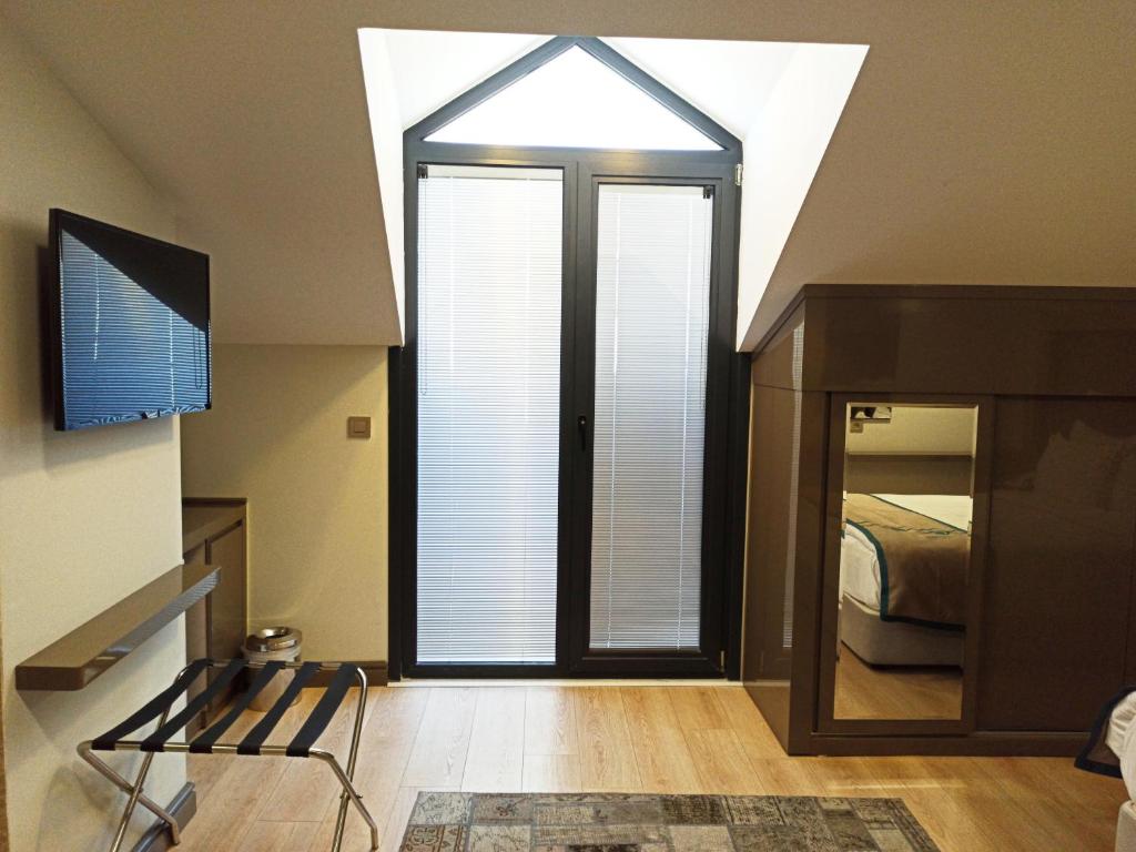 Postel nebo postele na pokoji v ubytování Peyk Hotel Oldcity