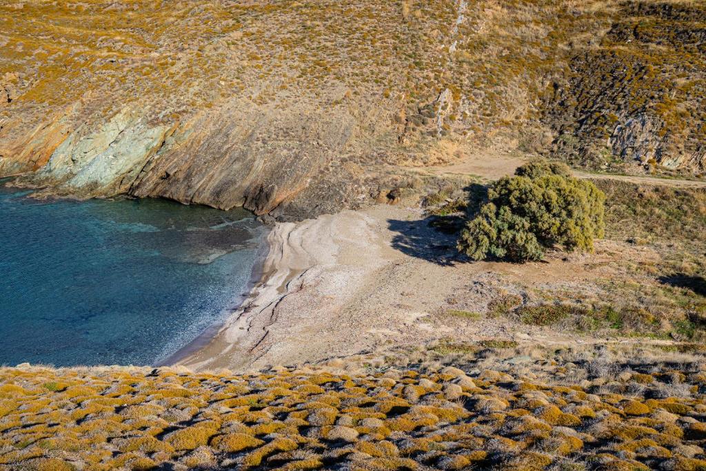 an aerial view of a rocky shore with the ocean at Amelia Beachfront Villa in Korissia