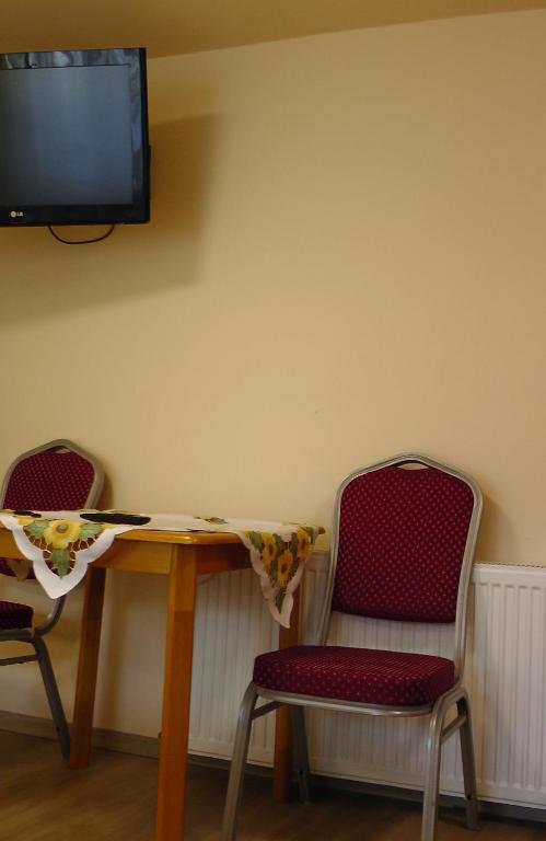TV a/nebo společenská místnost v ubytování Green Lake Airport Apartments
