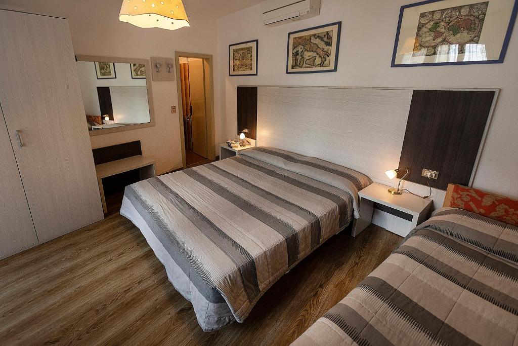 Postel nebo postele na pokoji v ubytování Hotel Al Molino