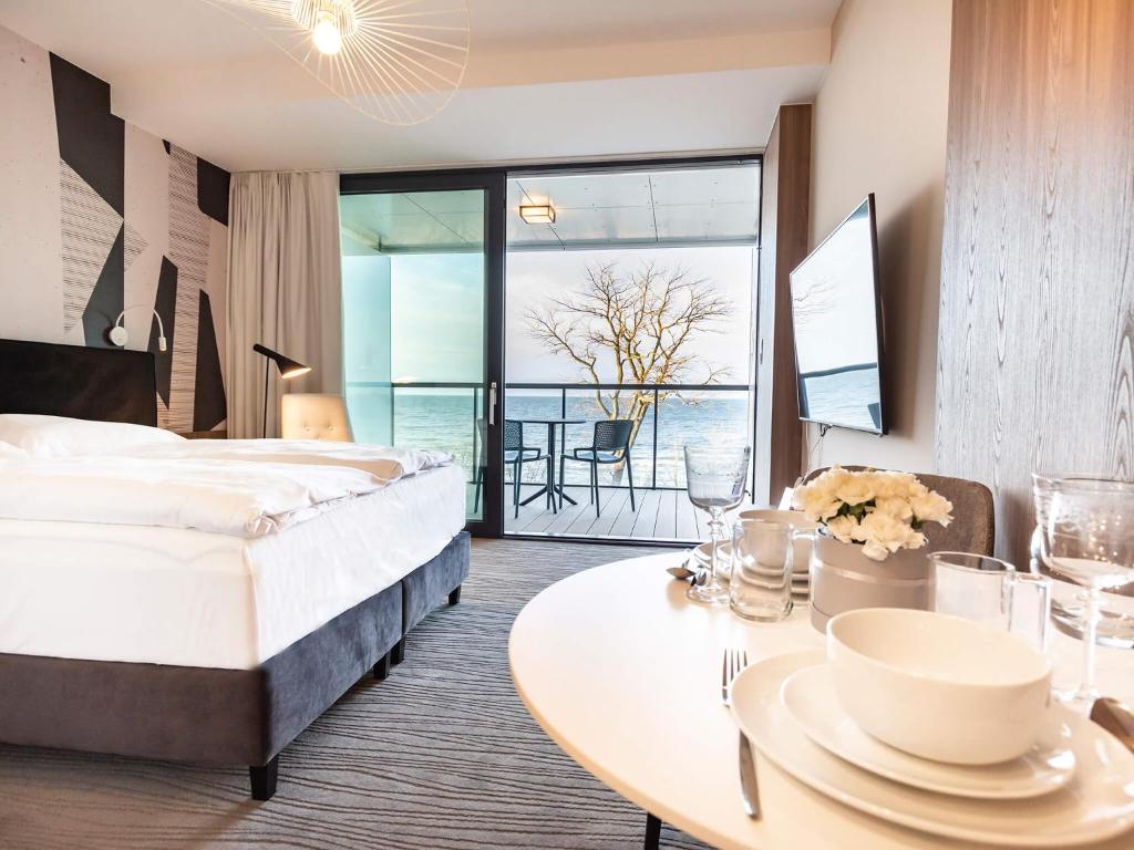 Posteľ alebo postele v izbe v ubytovaní VacationClub – Seaside Apartament 410