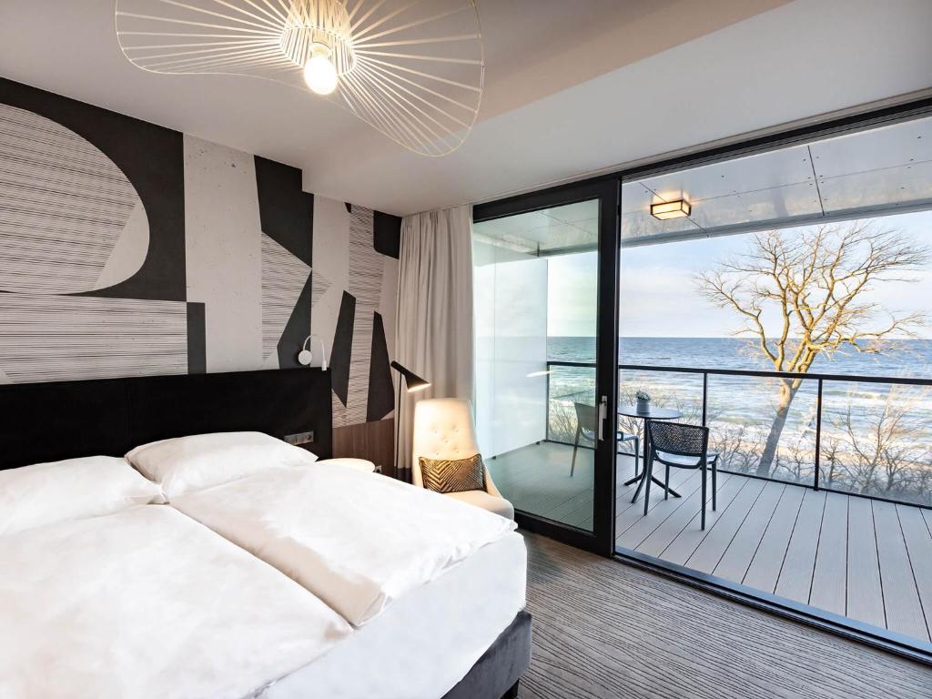 Posteľ alebo postele v izbe v ubytovaní VacationClub – Seaside Apartament 410