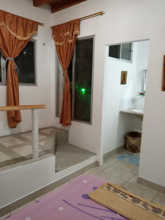 Postel nebo postele na pokoji v ubytování Hospedaje Algarrobo Machalilla