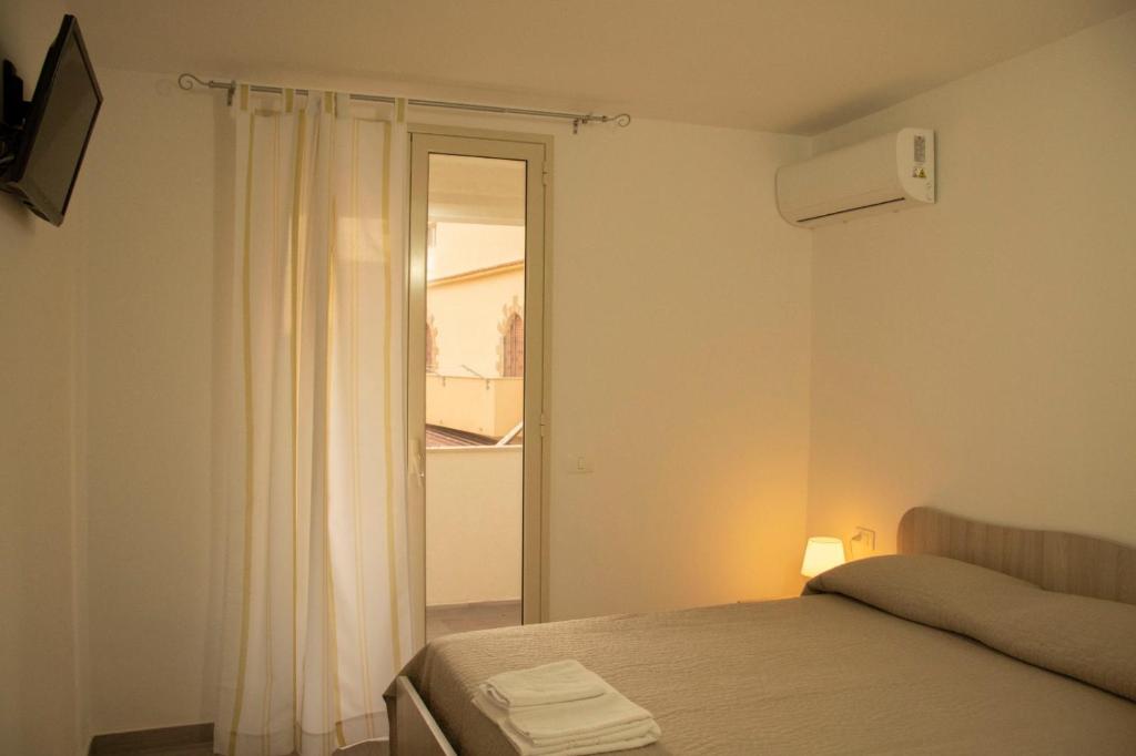 Postel nebo postele na pokoji v ubytování B&b villa Arena