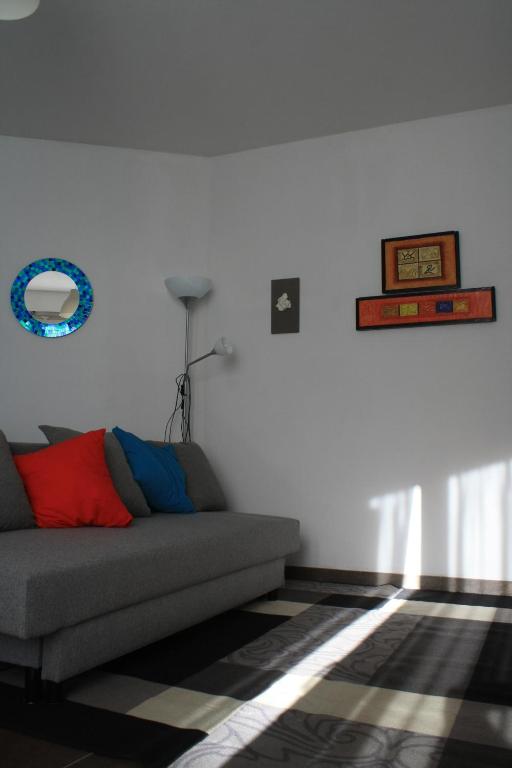 a living room with a couch and a rug at TataBlu residenza con parcheggio in Florence