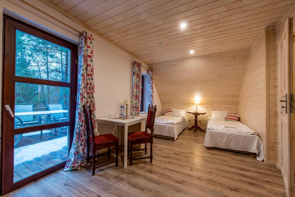 Posteľ alebo postele v izbe v ubytovaní Domek Lipowy Most