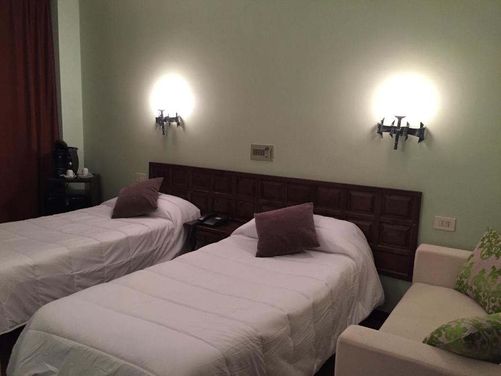 Postel nebo postele na pokoji v ubytování Hotel Folch
