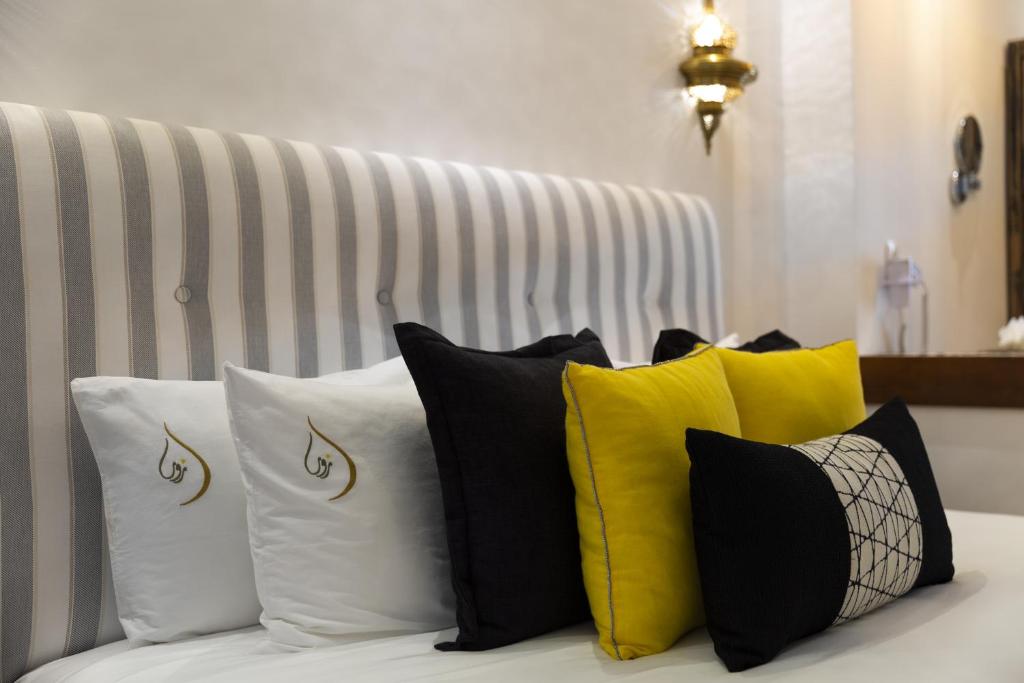 Un ou plusieurs lits dans un hébergement de l'établissement Suite Azur Hotel