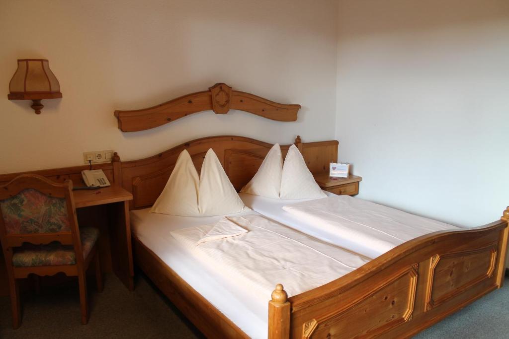 Postel nebo postele na pokoji v ubytování Hotel Restaurant Schwartz