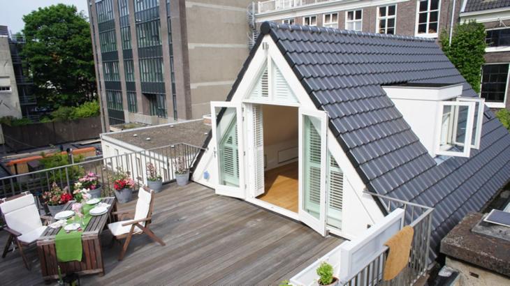a small house with a roof on a balcony at Prince On The Roof in Amsterdam