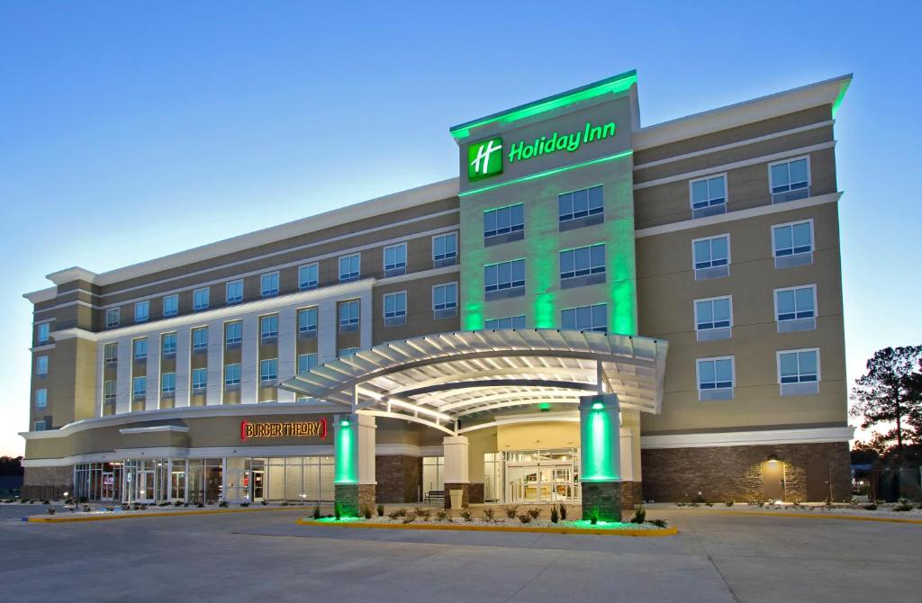 a hotel building with a sign on the front of it at Holiday Inn Hattiesburg - North, an IHG Hotel in Hattiesburg