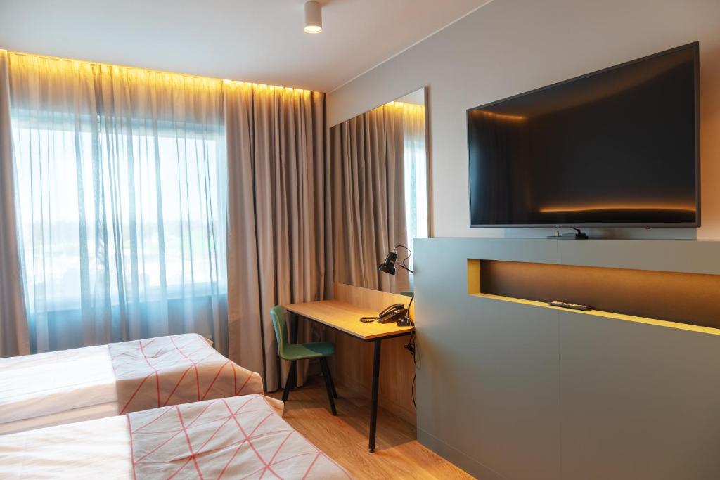 TV a/nebo společenská místnost v ubytování Holiday Inn Helsinki - Expo by IHG