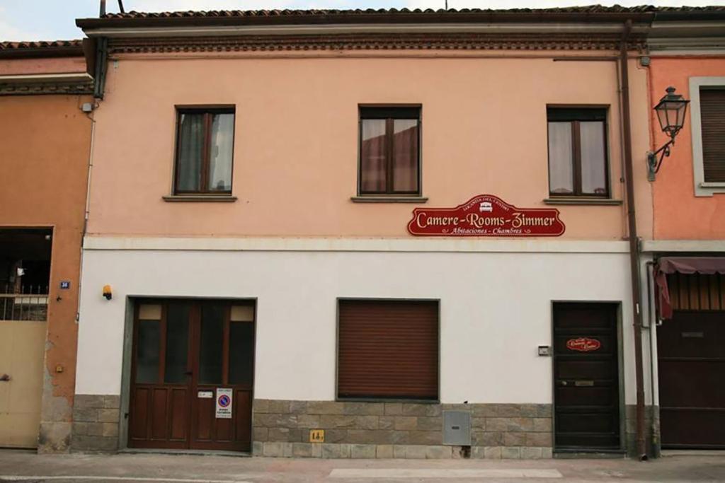 a building with a sign on the front of it at Locanda Del Centro in Cambiano